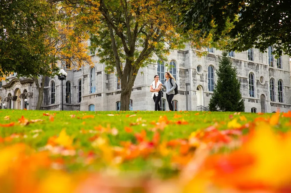 Students outdoors walking on campus.